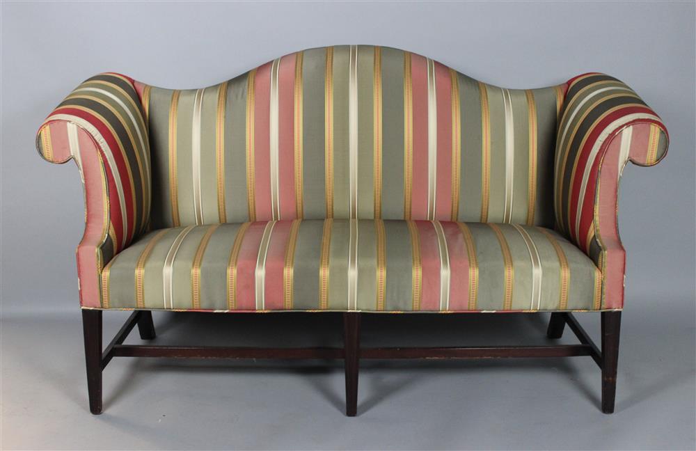 Appraisal: GEORGE III STYLE MAHOGANY CAMELBACK SOFA the arched padded back