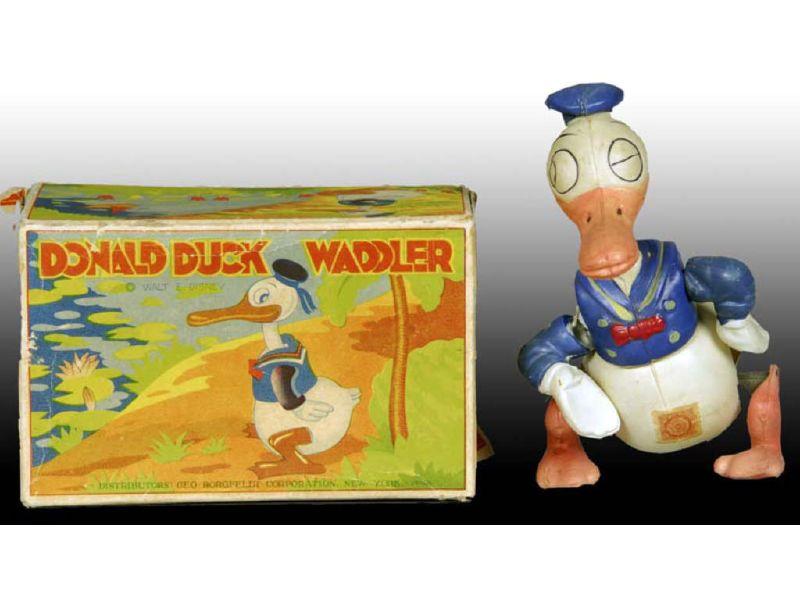 Appraisal: Walt Disney Celluloid Donald Duck Waddler Toy with Description -