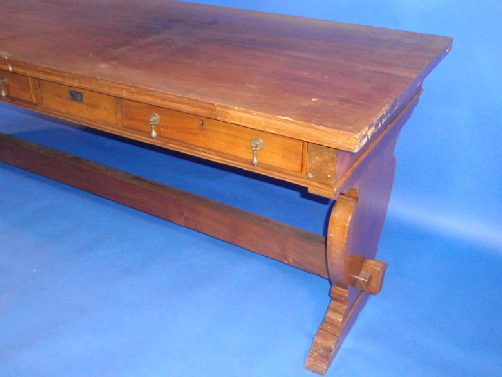 Appraisal: A walnut refectory type serving table with three frieze drawers