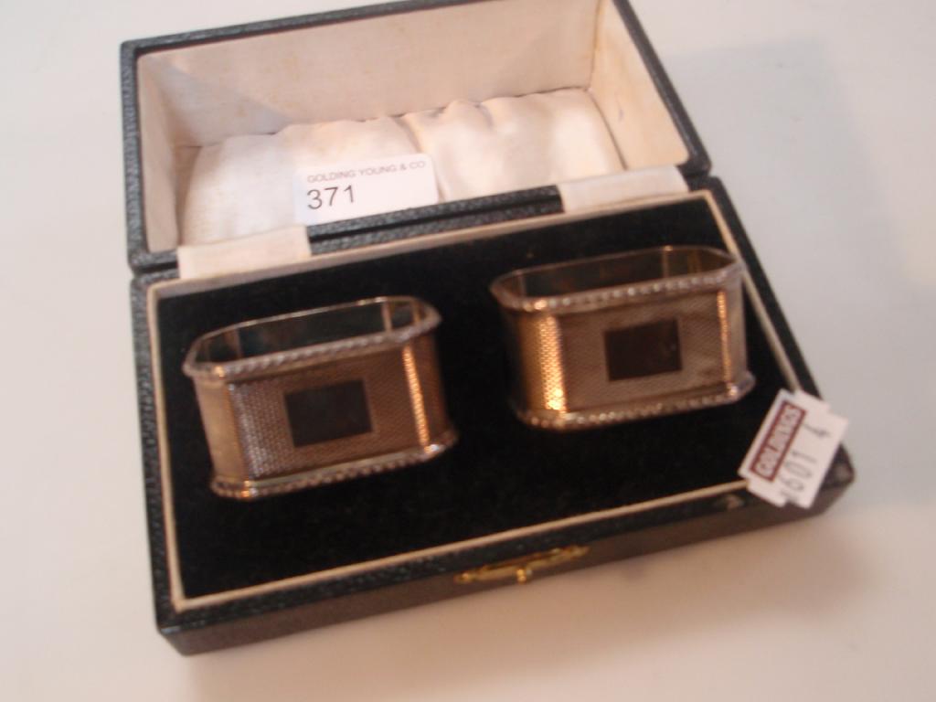 Appraisal: A pair of octagonal silver napkin rings cased Birmingham assay