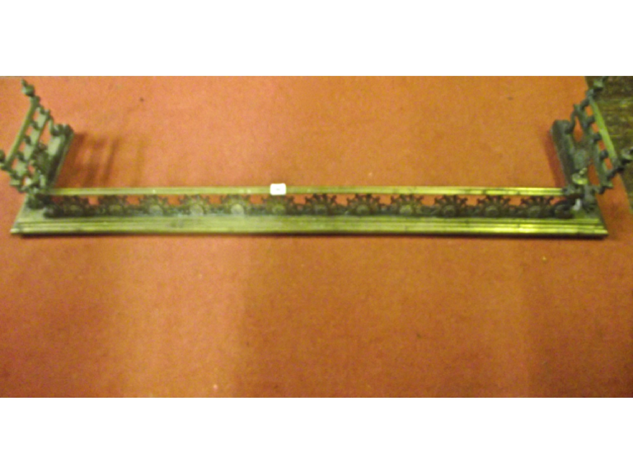 Appraisal: A good quality aesthetic movement brass fender with repeating sunflower