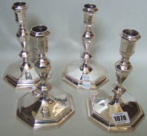 Appraisal: A set of four silver Britannia standard table candlesticks each