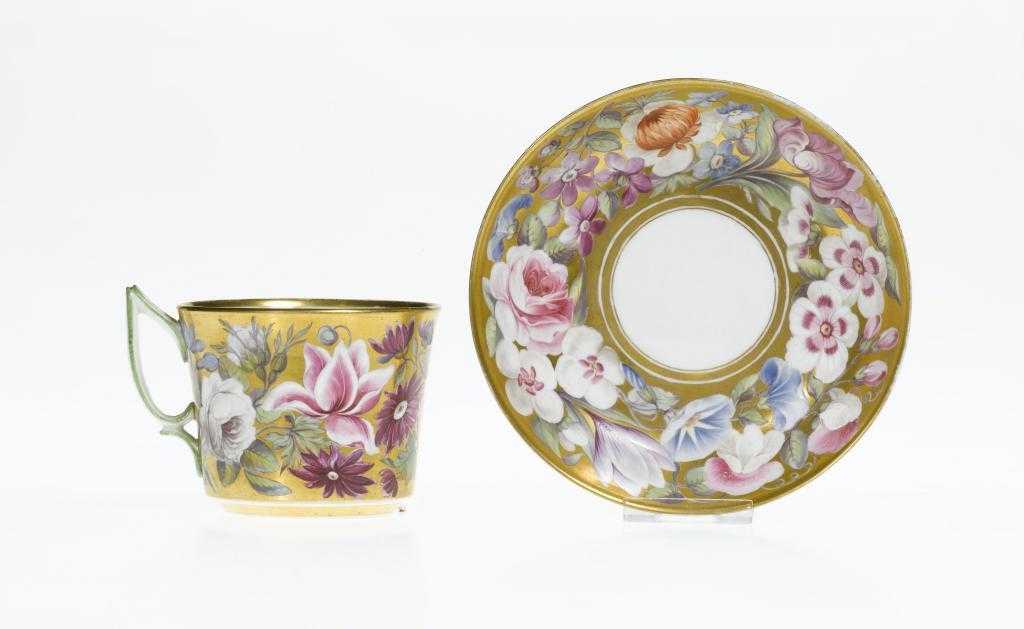 Appraisal: A DERBY GOLD GROUND TEACUP AND SAUCER DECORATED BY JAMES