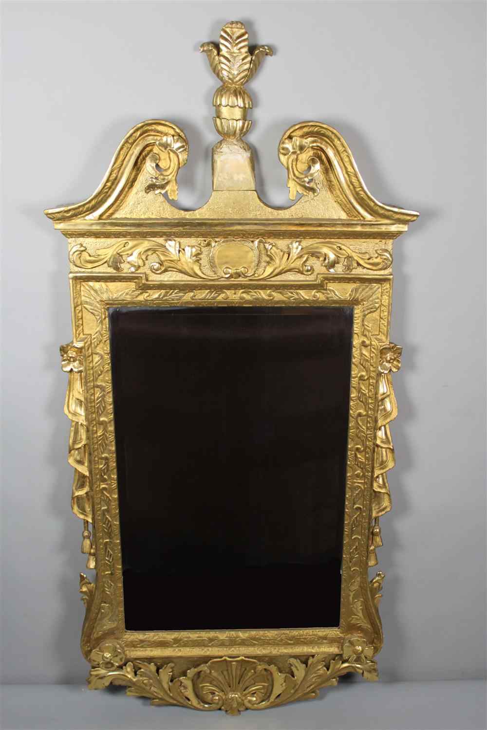 Appraisal: GEORGE II GILTWOOD MIRROR th century the swan's neck pediment