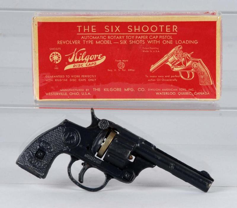 Appraisal: Kilgore Six-Shooter Disc Cap Gun Description The cast iron disc