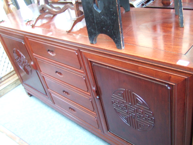 Appraisal: A th century hardwood Chinese sideboard with four short drawers