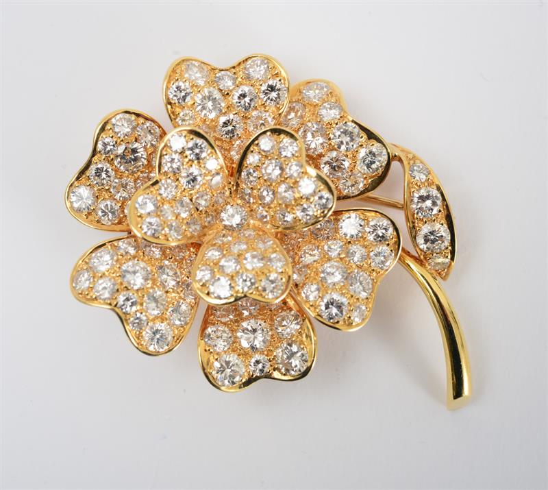 Appraisal: K GOLD AND DIAMOND BROOCH Designed as a flower set