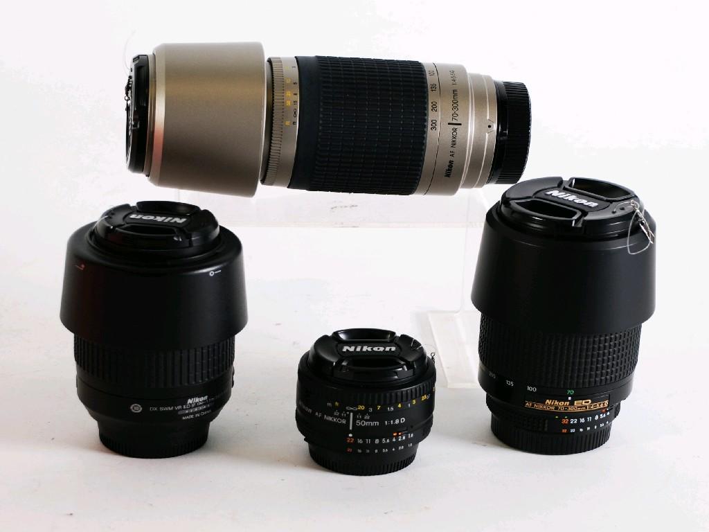 Appraisal: FOUR NIKON CAMERA LENSES comprising Nikkor - mm f -