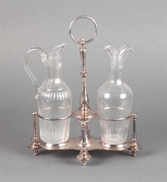 Appraisal: French silver-plate on brass cruet stand with two bottles for