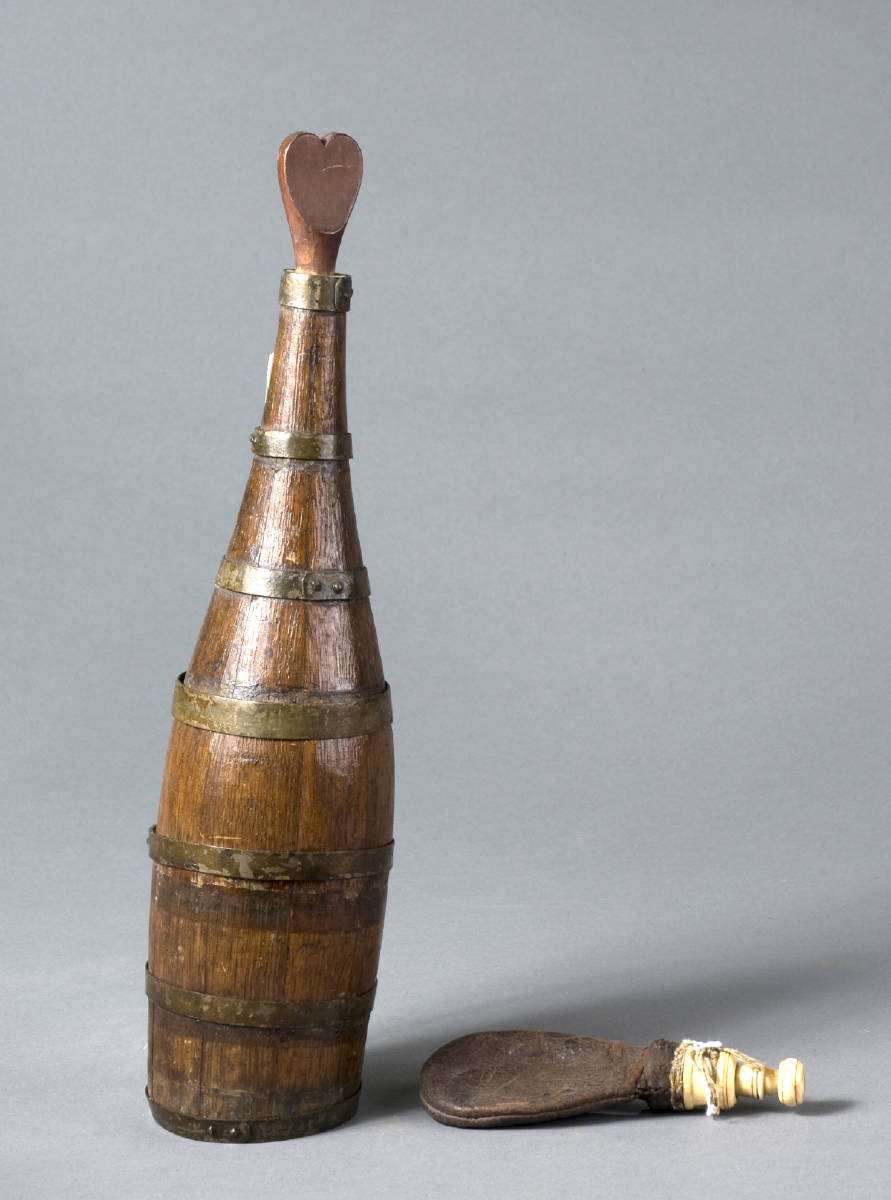 Appraisal: SAILOR'S STAVED WOODEN WINE BOTTLE WITH HEART-SHAPED STOPPER Together with