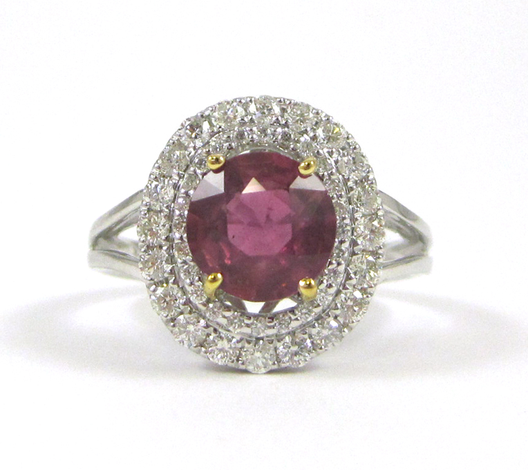 Appraisal: PINK SAPPHIRE DIAMOND AND FOURTEEN KARAT GOLD RING with TGL