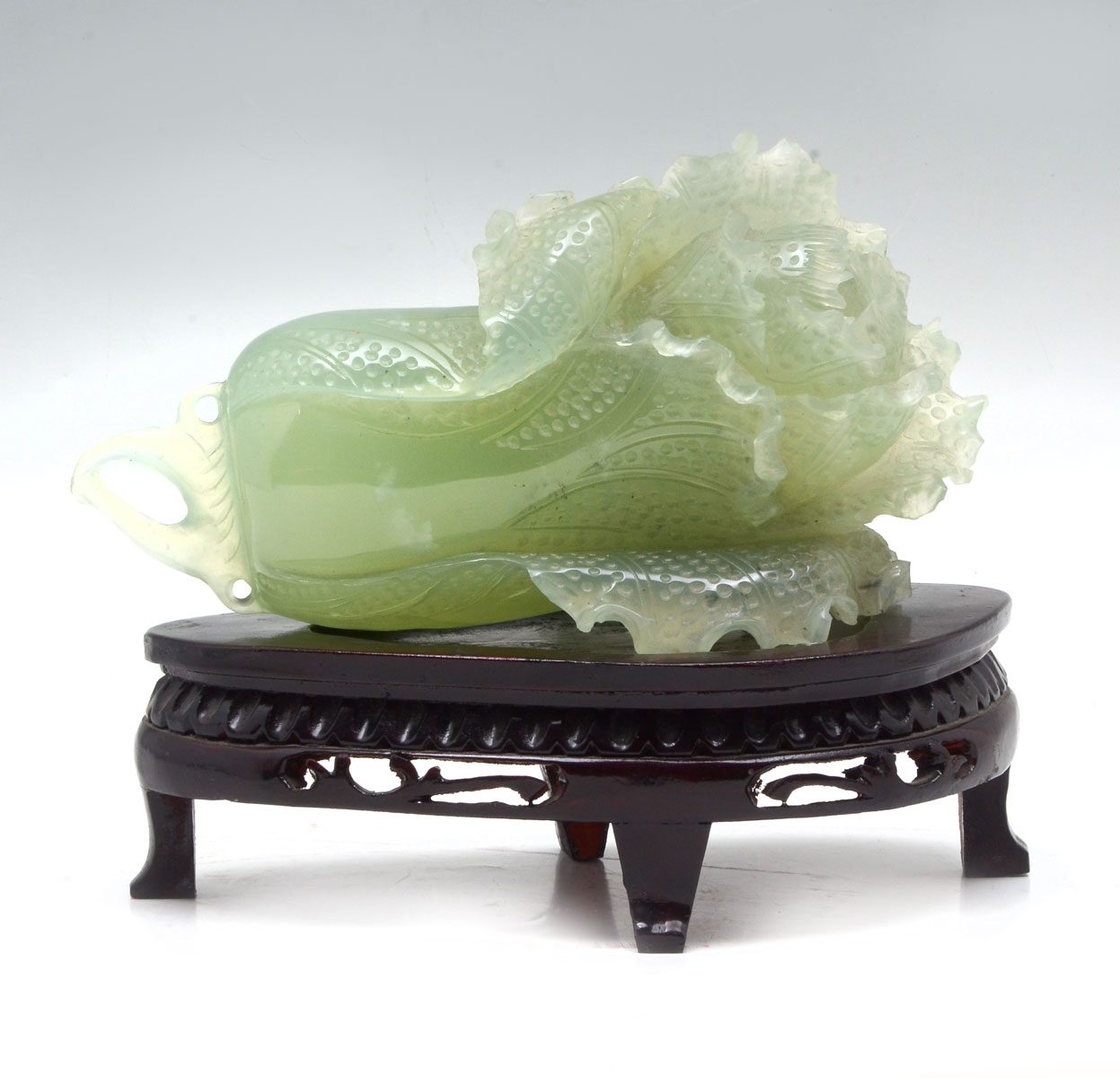 Appraisal: CHINESE CARVED CELADON GREEN JADE CABBAGE Carved pierced Chinese celadon