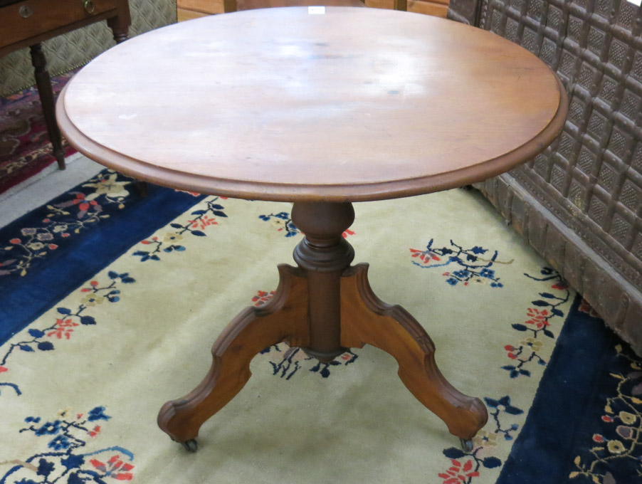 Appraisal: ROUND VICTORIAN WALNUT CENTER TABLE American th century the top