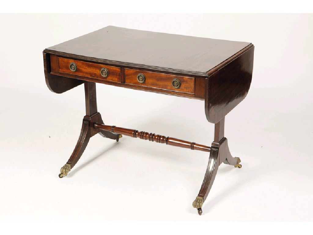 Appraisal: A REGENCY MAHOGANY SOFA TABLE the rectangular top with twin