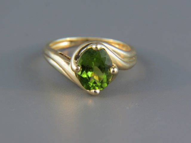 Appraisal: Peridot Ring vivid oval gem weighing carats in k yellow