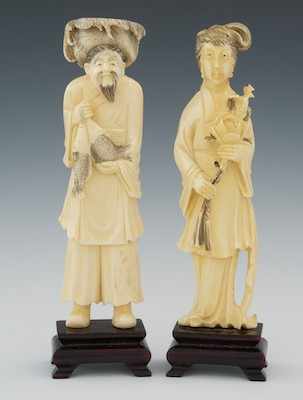 Appraisal: A Pair of Carved Ivory Figures Both standing figures with