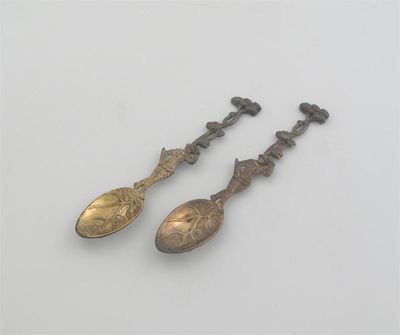 Appraisal: A pair of George II III cast silvergilt teaspoons the