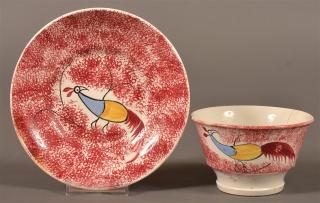 Appraisal: Red Spatter China Peafowl Cup and Saucer Red Spatter China