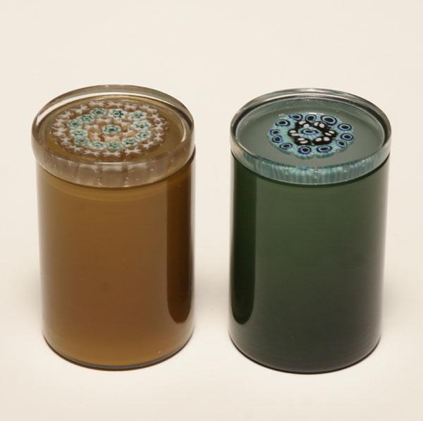 Appraisal: Venini Murrine glass jars Green and amber bodies with paperweight