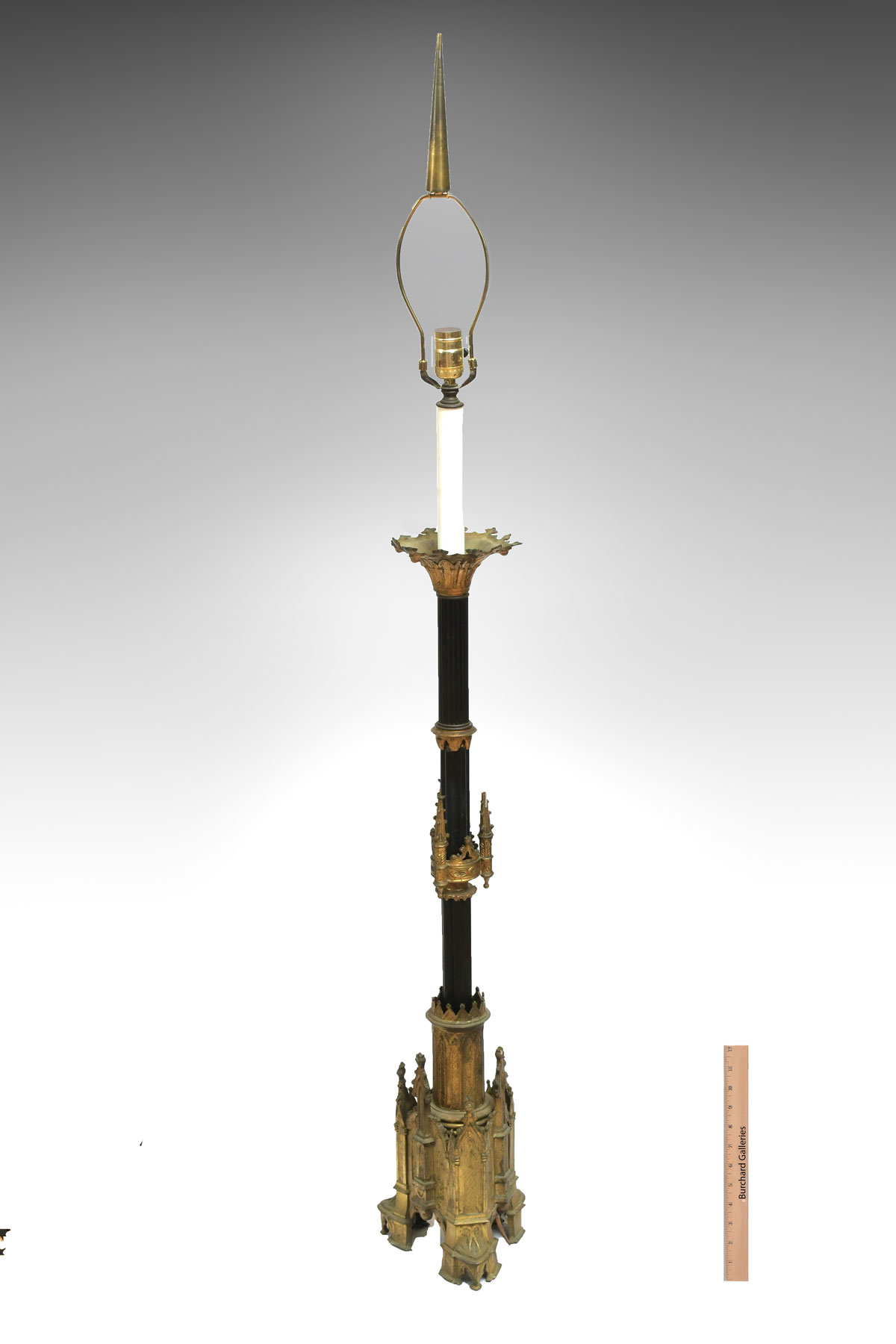 Appraisal: GOTHIC CATHEDRAL FLOOR LAMP Cathedral motif brass floor lamp with