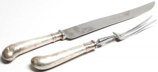 Appraisal: Sheffield Weighted Silver Carving Utensils Comprising a carving knife and