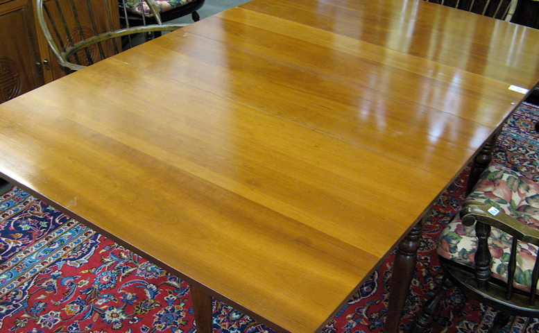 Appraisal: CHERRY DROP-LEAF DINING TABLE WITH TWO LEAVES American th century