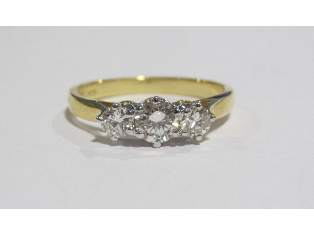 Appraisal: An eighteen carat gold diamond three stone ring with brilliant