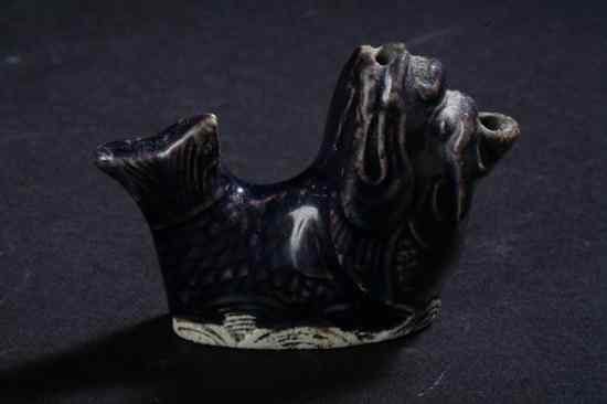 Appraisal: KOREAN AUBERGINE PORCELAIN FISH-FORM WATER DROPPER Choson dynasty - in