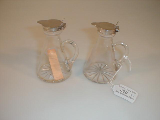 Appraisal: Two George V glass communion flasks with silver mounts star