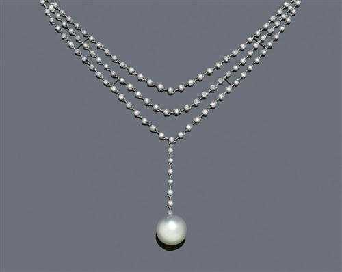 Appraisal: PEARL AND DIAMOND NECKLACE White gold Elegant decorative Y -shaped