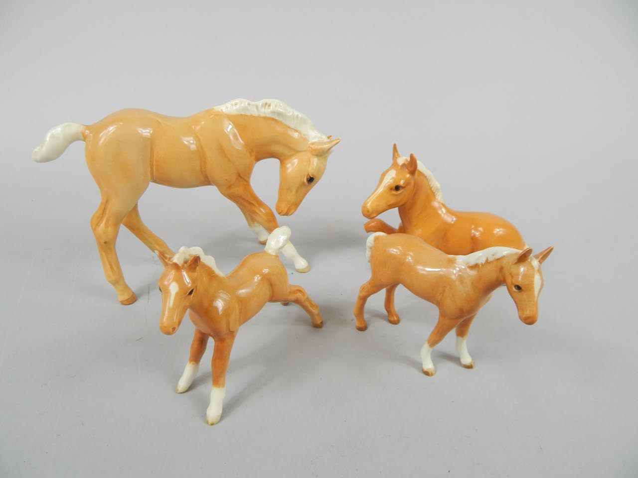 Appraisal: Various Beswick Palomino horses to include recumbent pony cm wide