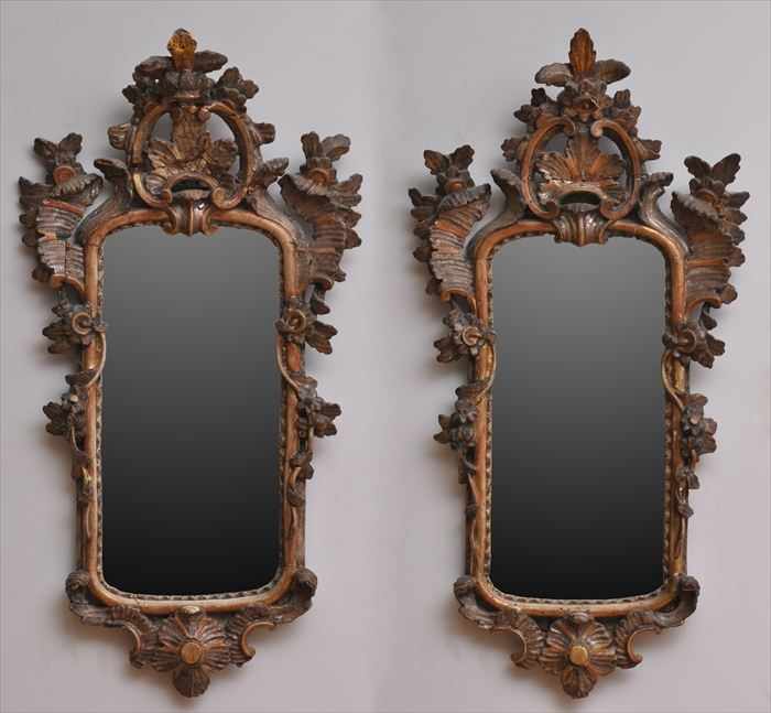 Appraisal: PAIR OF SMALL ITALIAN ROCOCO CARVED WALNUT MIRRORS Each plate