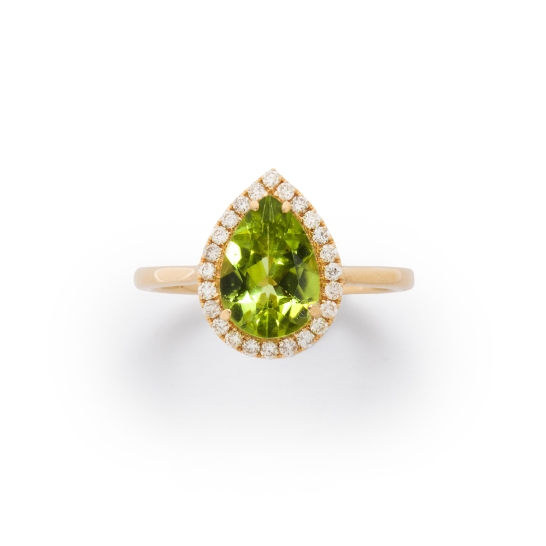 Appraisal: A PERIDOT DIAMOND AND FOURTEEN KARAT GOLD RING A peridot