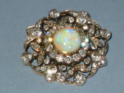 Appraisal: A LATE VICTORIAN DIAMOND AND OPAL BROOCH comprising central opal