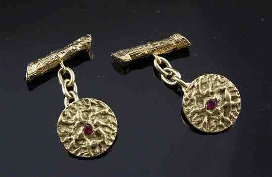 Appraisal: A pair of ruby set ct textured gold cufflinks gross