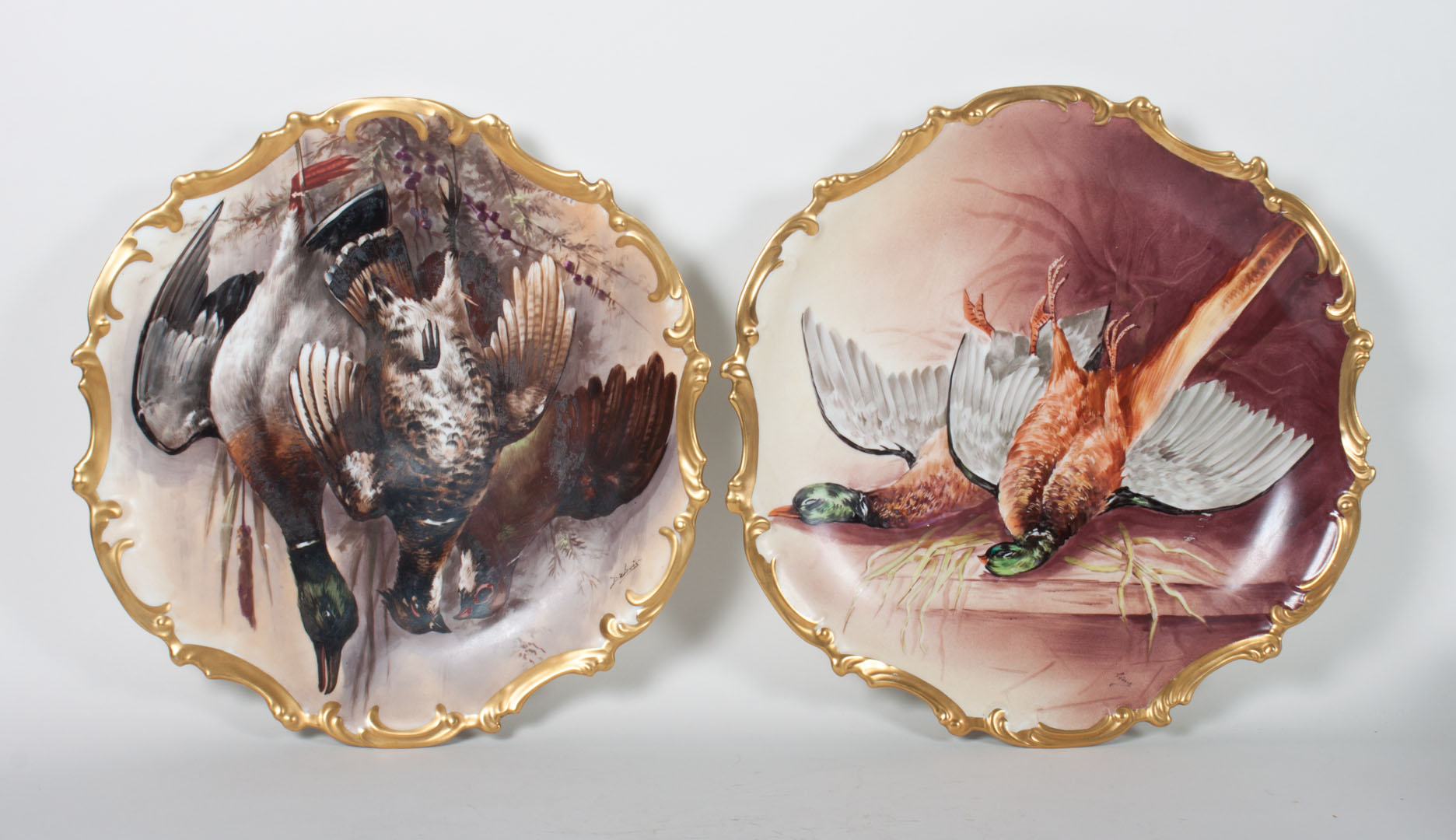 Appraisal: Pair of Limoges painted porcelain game plaques early th century