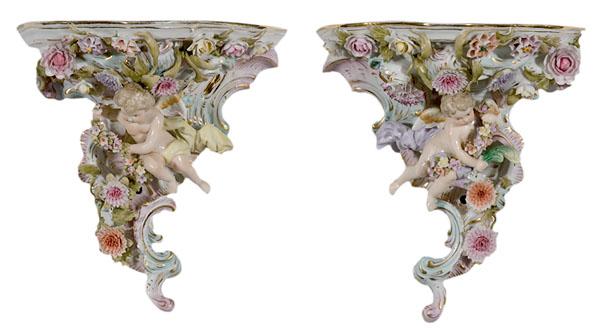 Appraisal: PAIR OF FIGURAL PORCELAIN WALL SCONCESWITH CHERUBS Continental th century