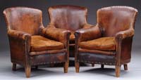 Appraisal: SET OF THREE LEATHER UPHOLSTERED ARMCHAIRS First half of the