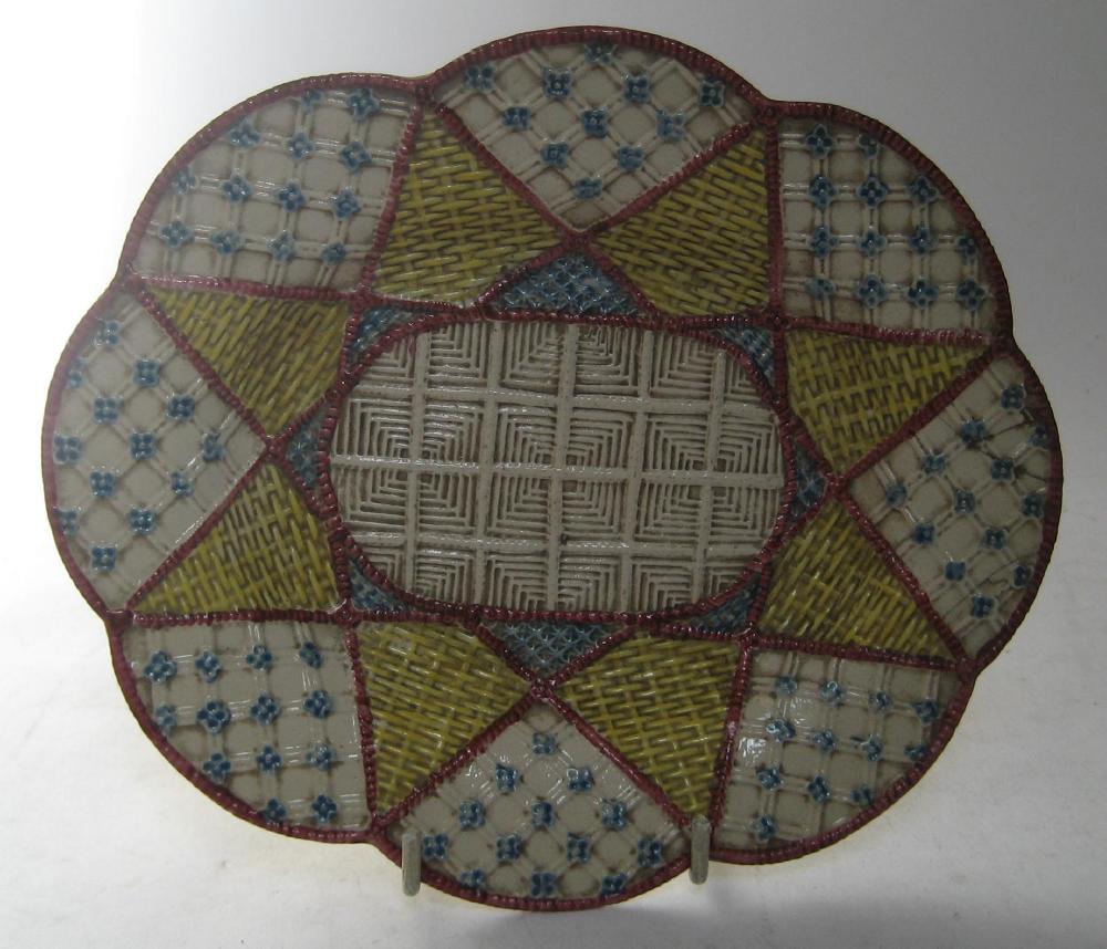 Appraisal: A POLYCHROME SALTGLAZE STONEWARE DISH mid th century of shaped