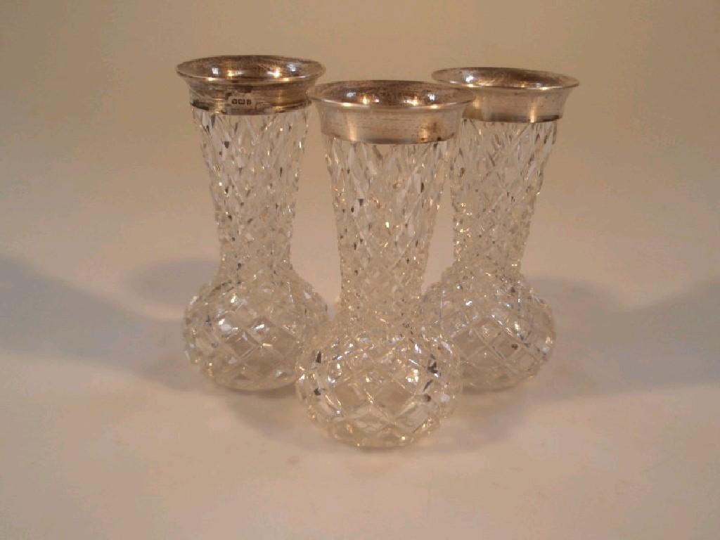 Appraisal: Three small cut glass flower vases with silver mounted rims