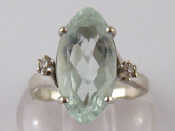 Appraisal: A white metal tests carat gold aquamarine and diamond ring