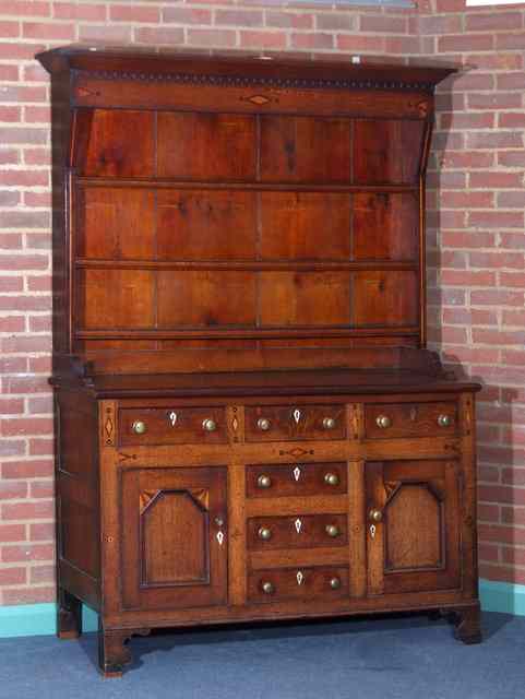 Appraisal: A GEORGE III OAK DRESSER the upper part with cavetto