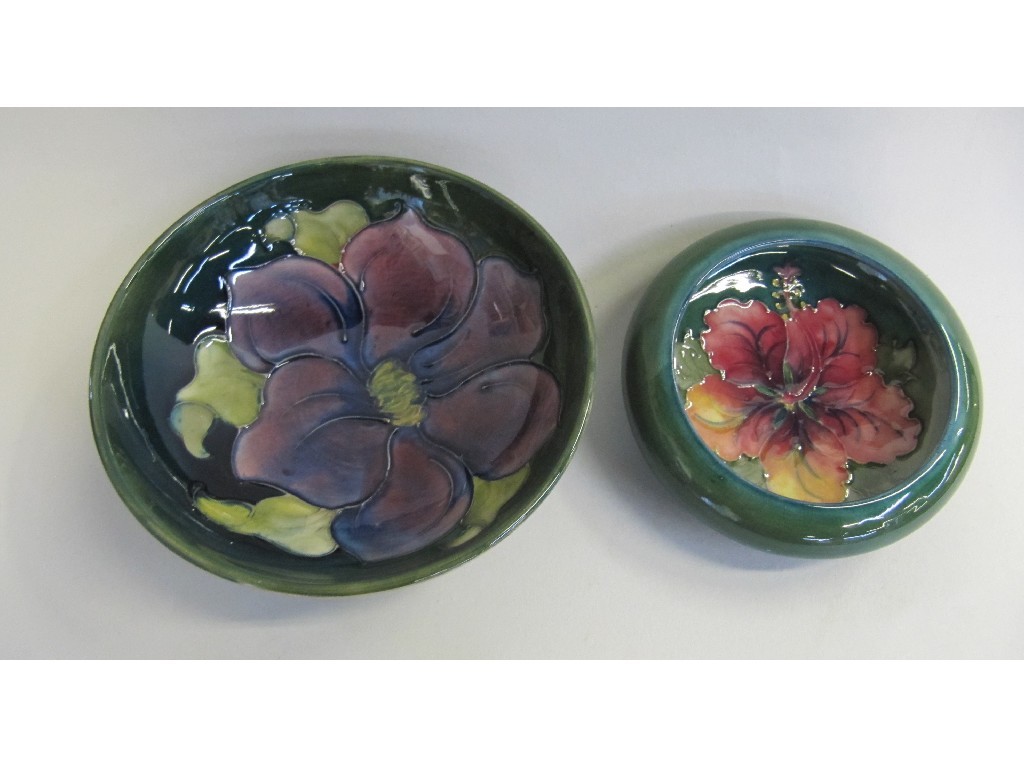 Appraisal: Two Moorcroft dishes one decorated with hibiscus the other clematis