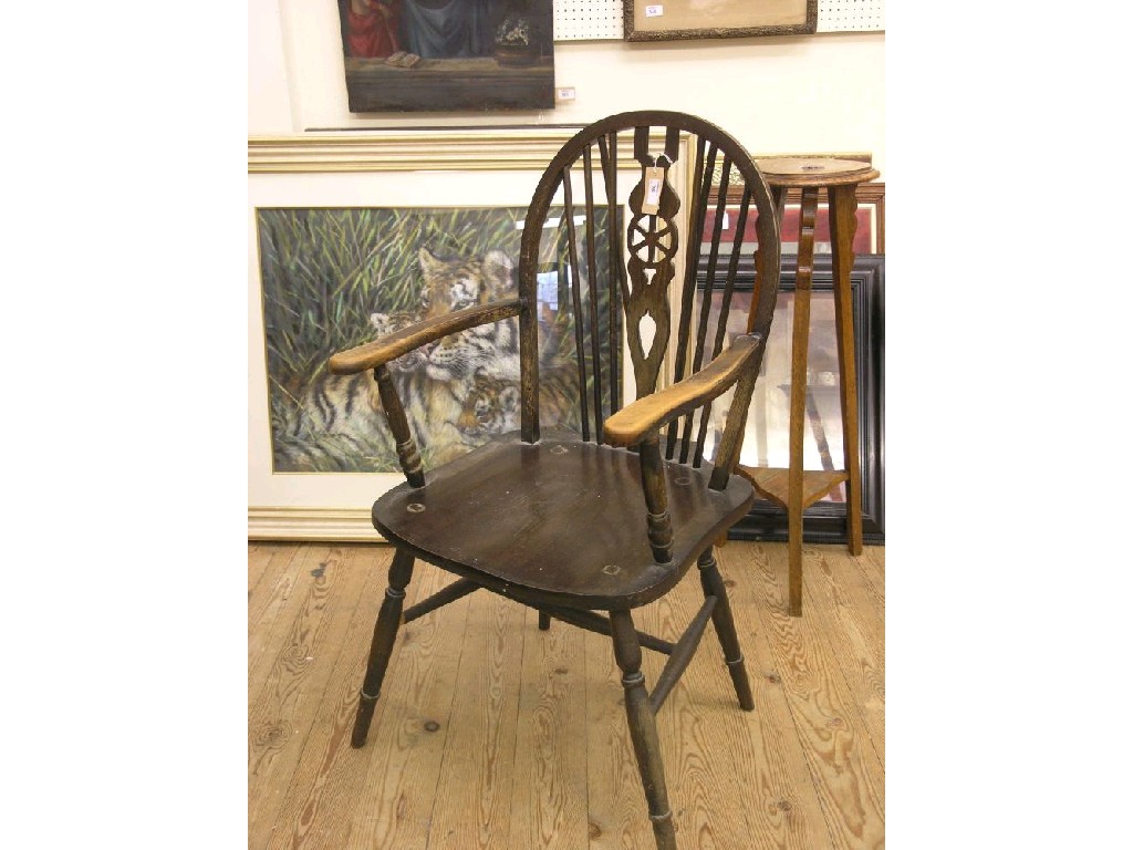 Appraisal: A set of five Windsor wheel-back dining chairs including carver