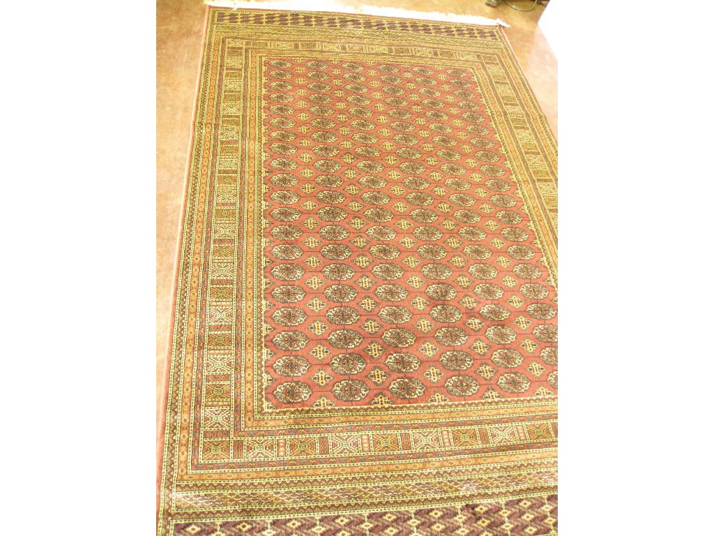 Appraisal: A Rose ground Bokhara Carpet ft in x ft in