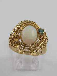 Appraisal: A yellow metal tests ct gold opal ring the central