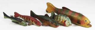 Appraisal: carved wooden ice fishing decoys lengths to carved wooden ice