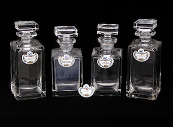 Appraisal: Four Heavy Crystal Decanters with Porcelain Labels A lot of