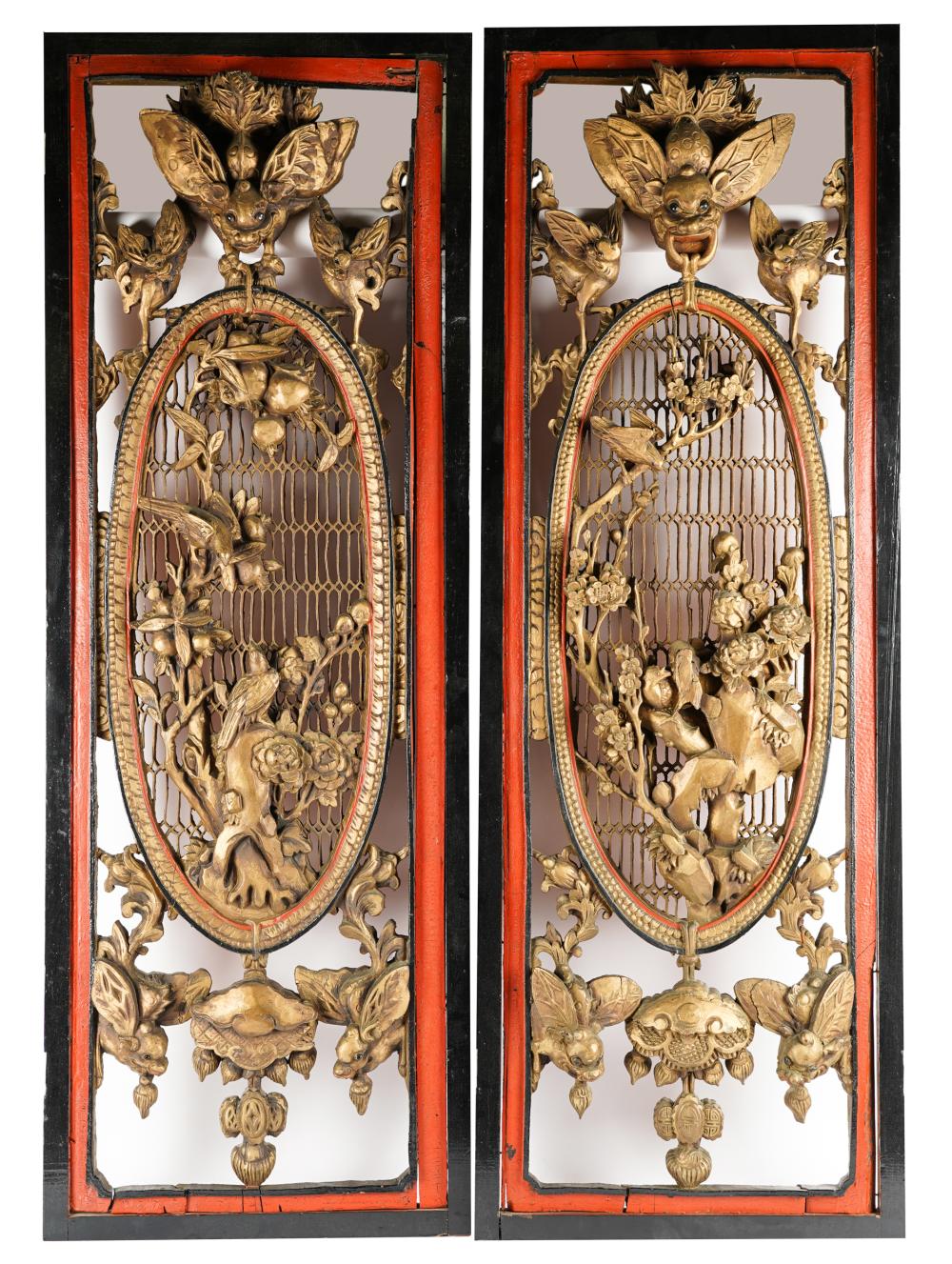 Appraisal: PAIR OF ASIAN CARVED GILTWOOD PANELSeach within a red and