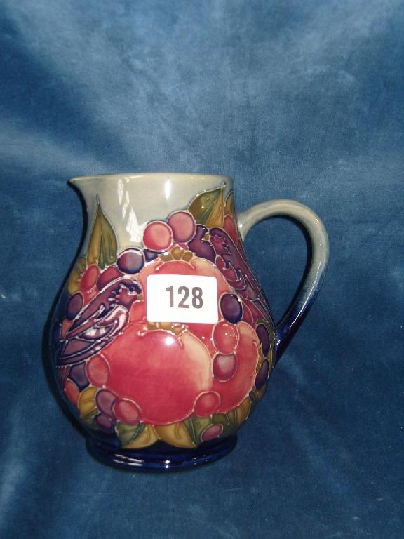 Appraisal: A Moorcroft jug designed by Sally Tuffin with finch and